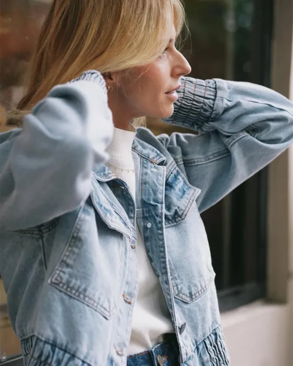 Model wearing a light denim jacket